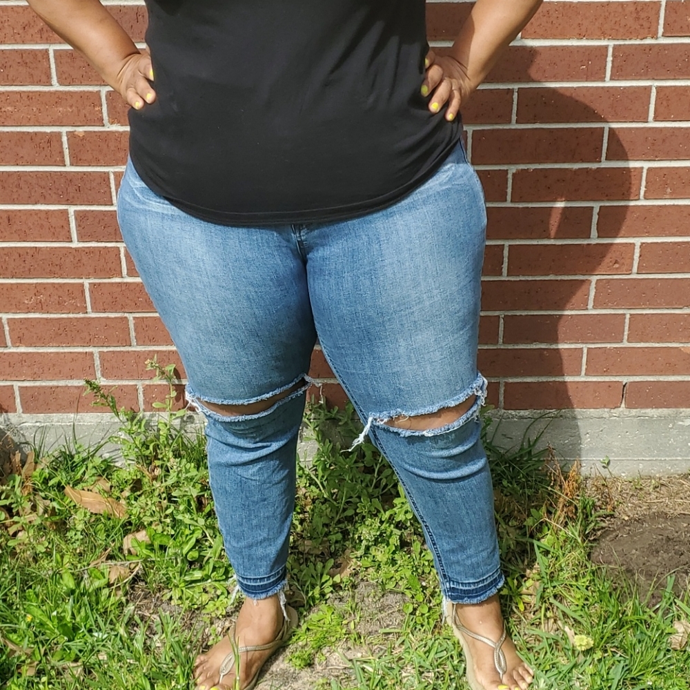 Celebrity Pink jeans with slit over each knee.